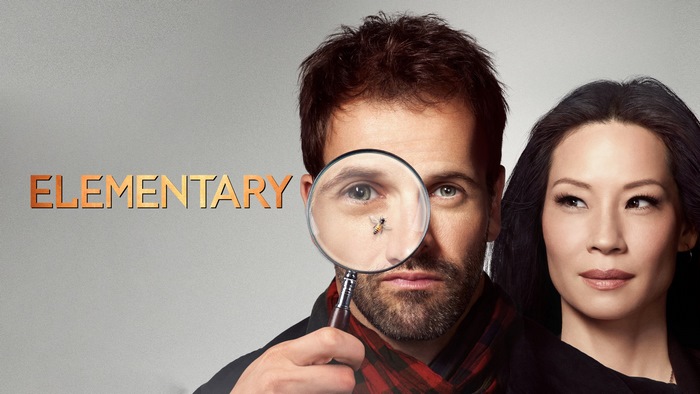 Elementary: Jonny Lee Miller and Lucy Liu with magnifying glass