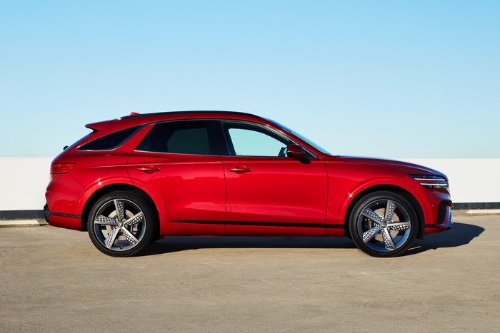 Red Genesis GV70 2.5T AWD SUV parked outdoors