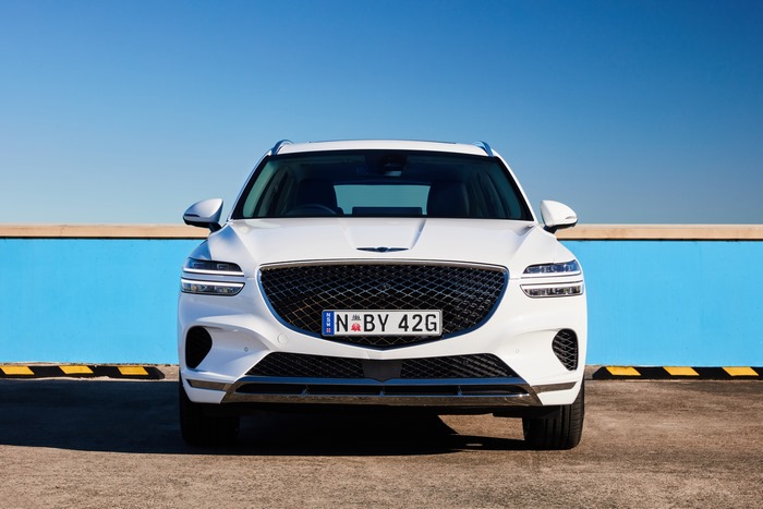 White Genesis GV70 SUV front view