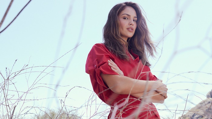 Eiza González in red shirt against sky