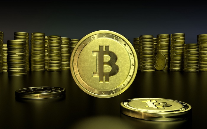 Golden Bitcoin and coin stacks