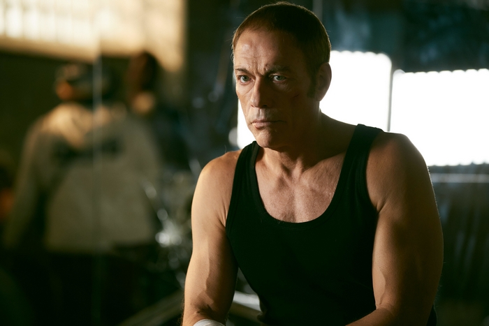 Jean-Claude Van Damme in black tank top from The Last Mercenary