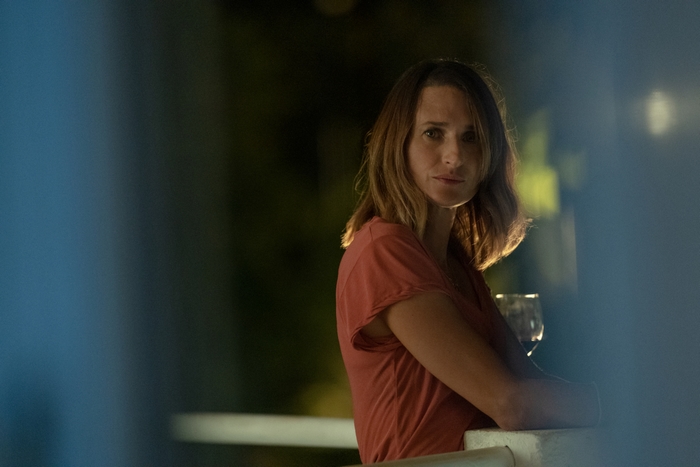 Camille Cottin in Stillwater, holding a wine glass