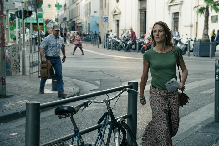 Camille Cottin walking on a Stillwater city street