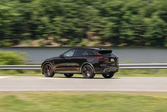Jaguar F-Pace SVR SUV driving fast by a lake