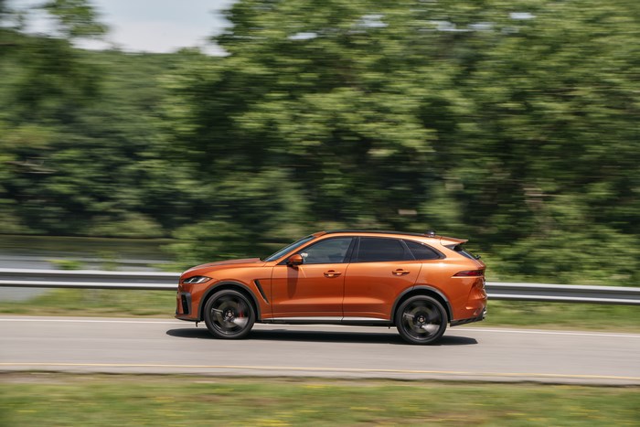 Orange Jaguar F-Pace SVR SUV in motion