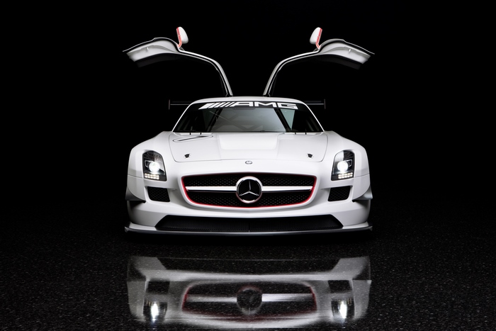 White Mercedes-Benz SLS AMG GT3 with open gullwing doors