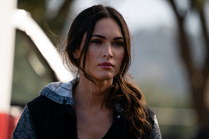 Megan Fox with a contemplative expression