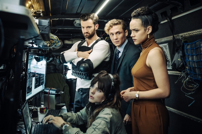 Army of Thieves team in a high-tech control room