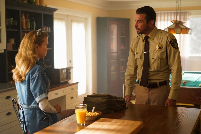 F. P. Jones as sheriff talking to a woman in Riverdale