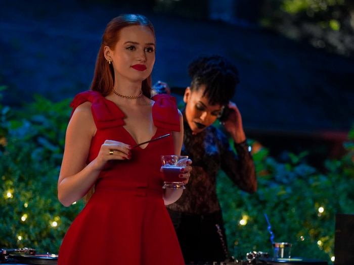 Cheryl Blossom in red dress at an outdoor party