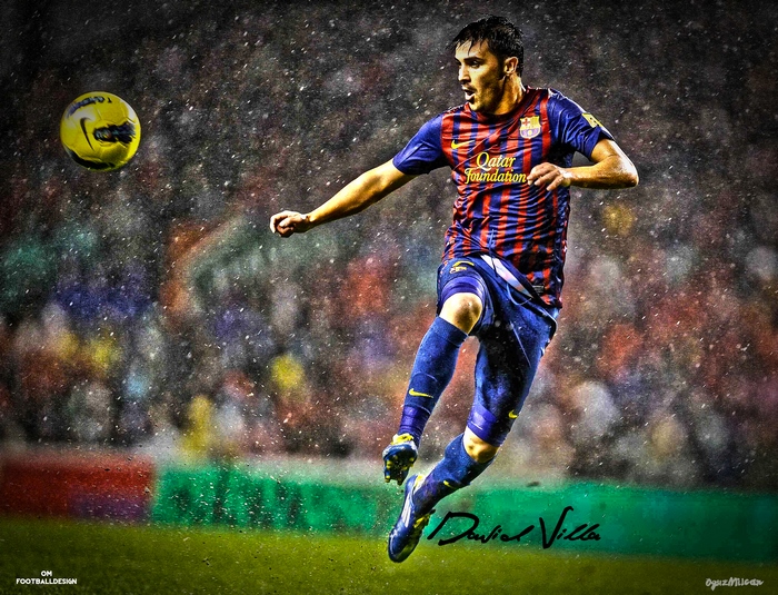 David Villa in FC Barcelona kit striking soccer ball