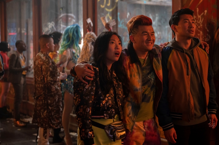 Awkwafina, Ronny Chieng, and Shang-Chi in a lively scene