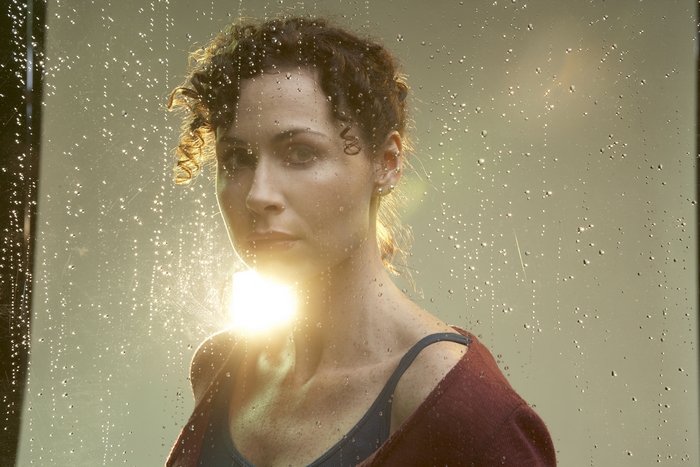 Minnie Driver, rainy backlit portrait