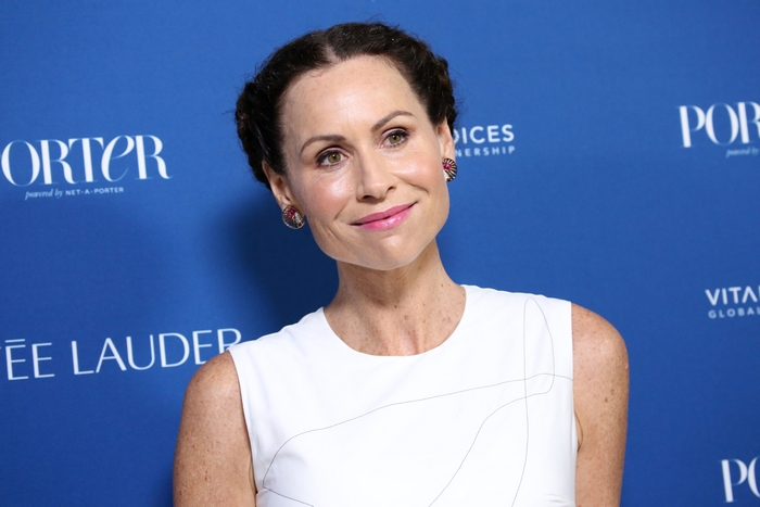 Minnie Driver smiling at an event