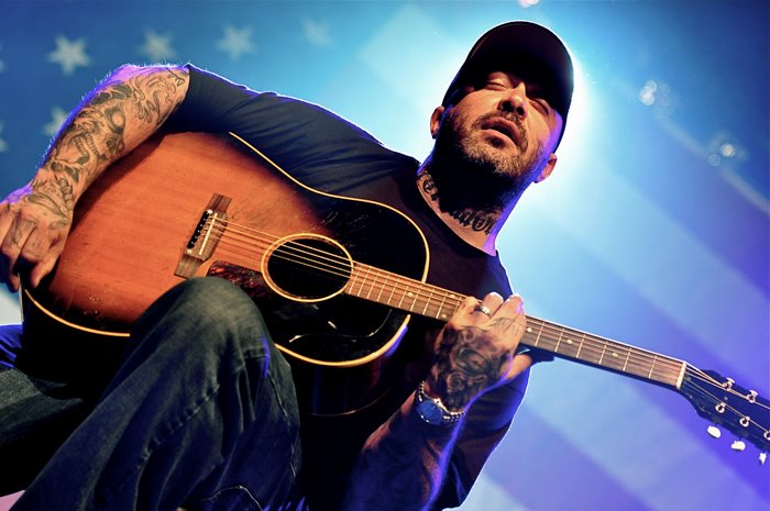 Aaron Lewis playing acoustic guitar live