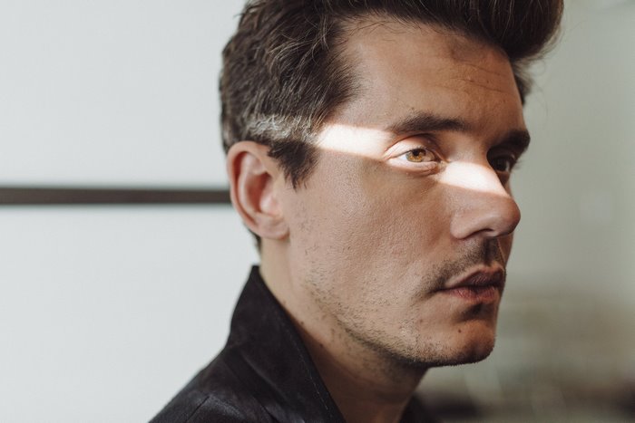 John Mayer's profile with dramatic lighting