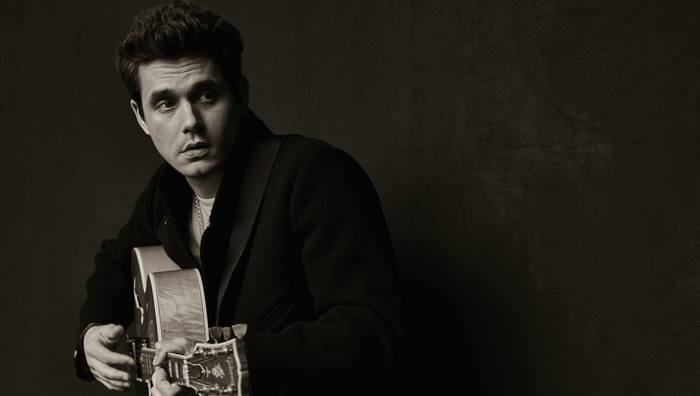 John Mayer portrait with acoustic guitar