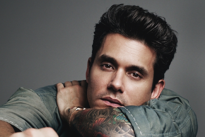John Mayer close-up portrait with tattooed arm and watch