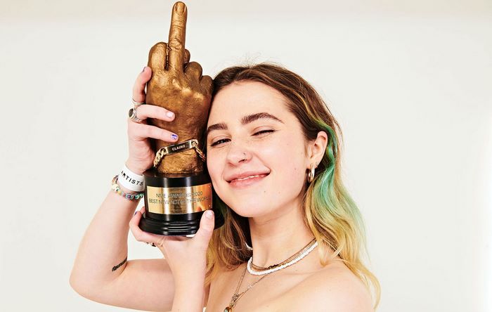 Clairo proudly holds NME Awards 2020 middle finger trophy
