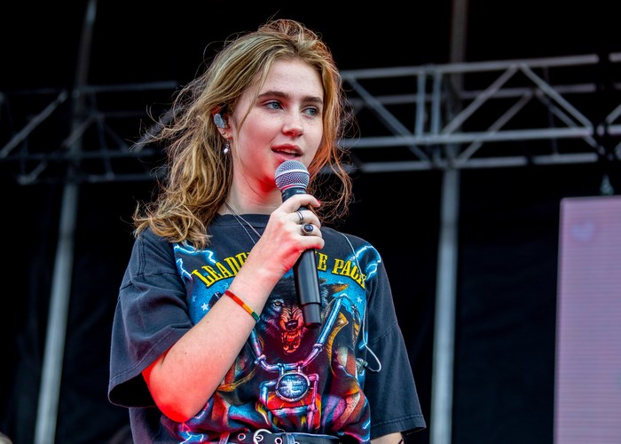 Clairo performing live on stage