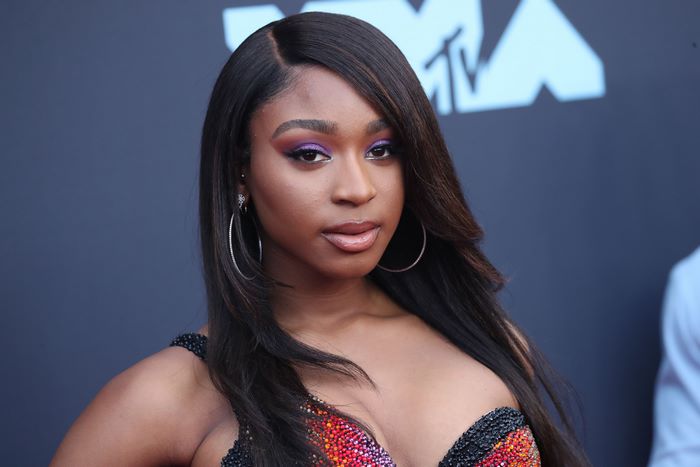Normani with purple eyeshadow and long dark hair at MTV