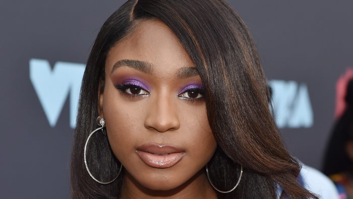 Normani with striking purple eyeshadow