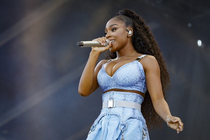 Normani performing live in a sparkling blue outfit