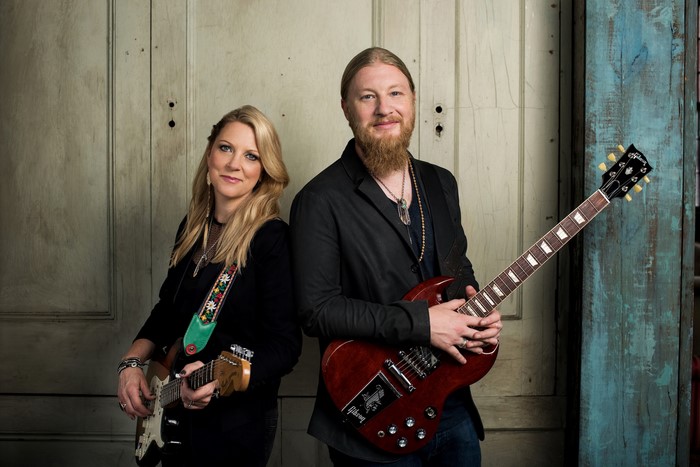 Tedeschi Trucks Band portrait with guitars