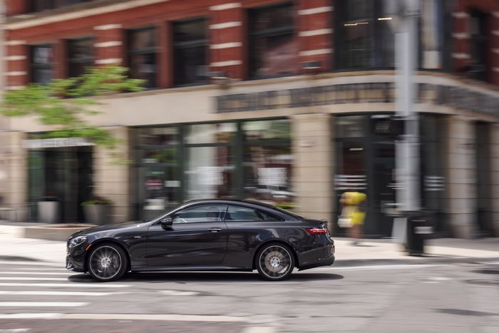 Luxury Mercedes-AMG E 53 Coupe in motion on city street