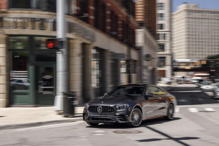 Luxury Mercedes-AMG E 53 Coupé in motion on city street