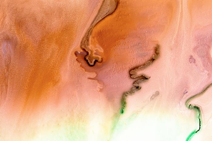 Abstract Fluid Paint Flow in Orange and Green
