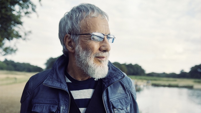 Cat Stevens outdoors with beard and glasses