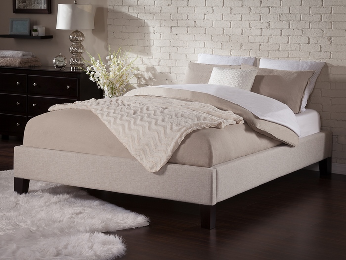 Upholstered Bed with Neutral Bedding in a Modern Bedroom