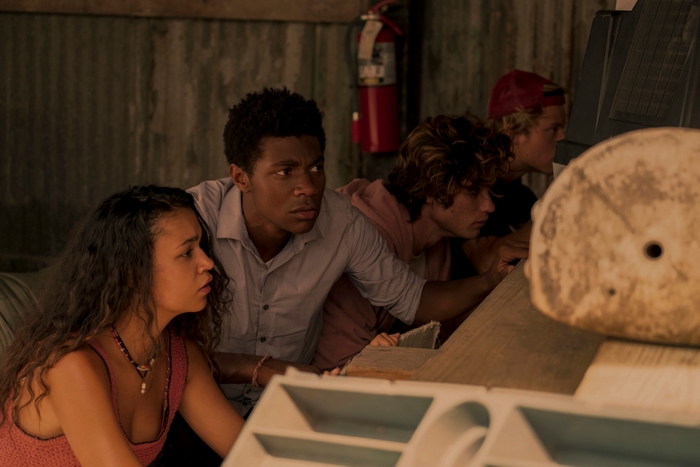 Outer Banks cast looking intently at something