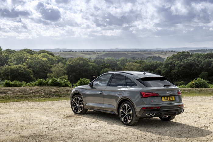 Grey Audi SQ5 Sportback SUV overlooking a green landscape