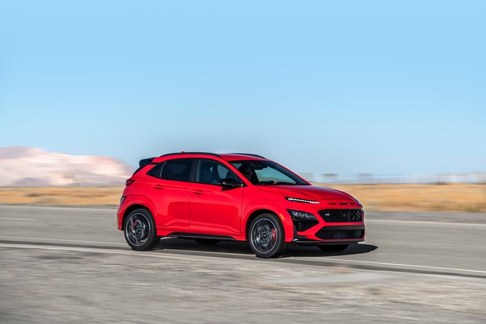 Red 2022 Hyundai Kona N SUV driving