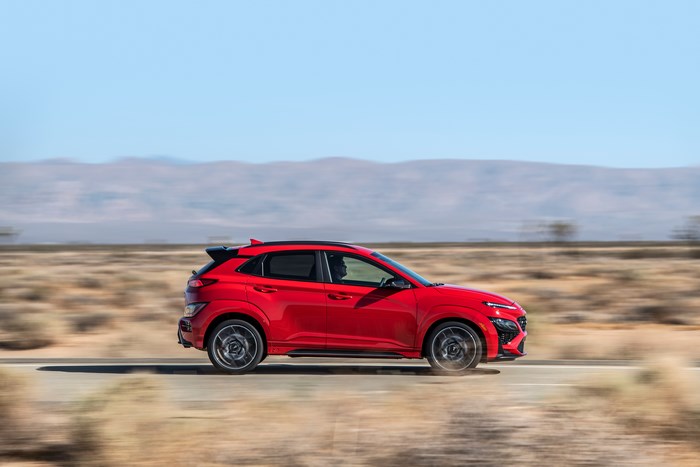 Red 2022 Hyundai Kona N SUV in motion
