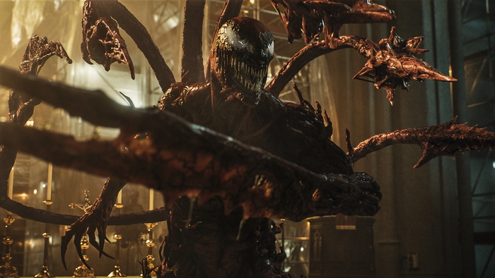 Carnage (Marvel Comics) menacingly extends tendrils in church