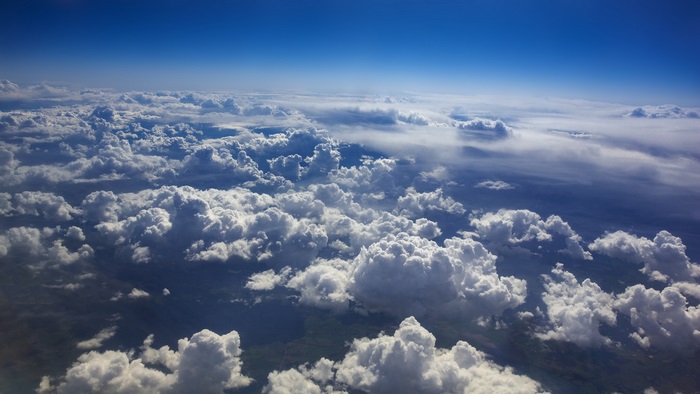 Aerial View of Majestic Clouds and Blue Sky