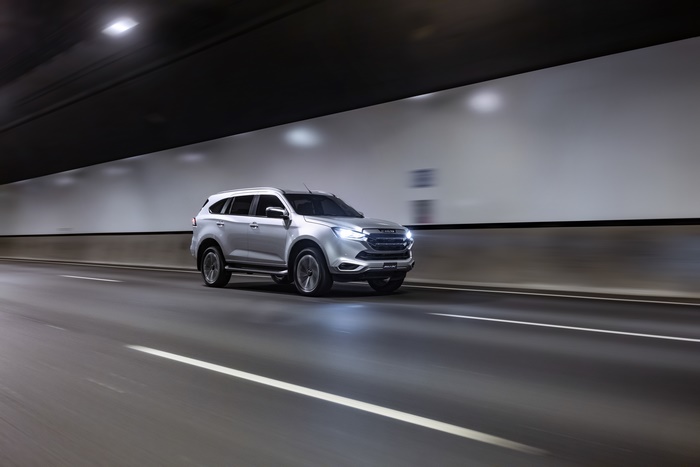 Isuzu MU-X SUV driving through a tunnel