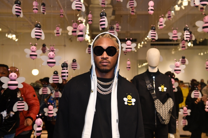 Future poses surrounded by pink bees