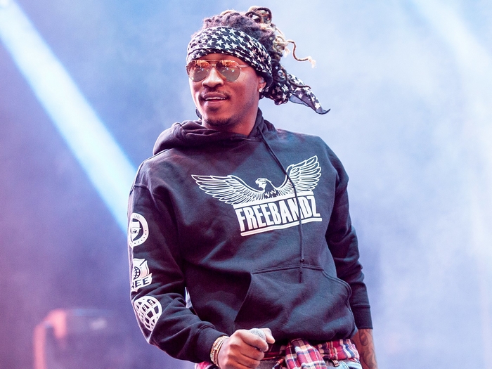 Rapper Future on stage with sunglasses and bandana