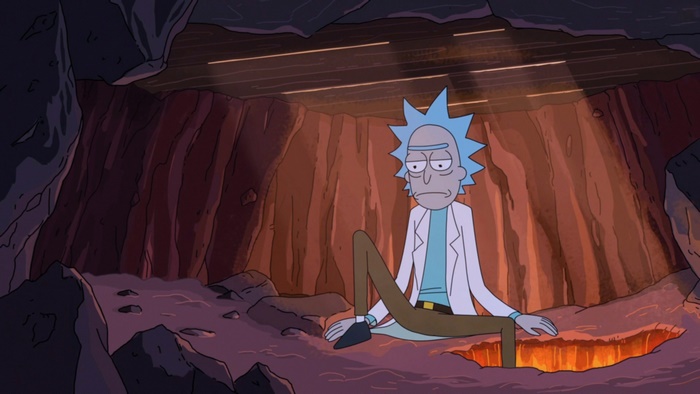 Rick Sanchez looking dejected in a cave