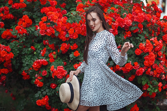 Brunette Model in Dress with Red Flowers and Hat