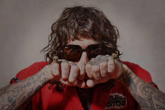 Yelawolf with Tattoos and Skull Rings