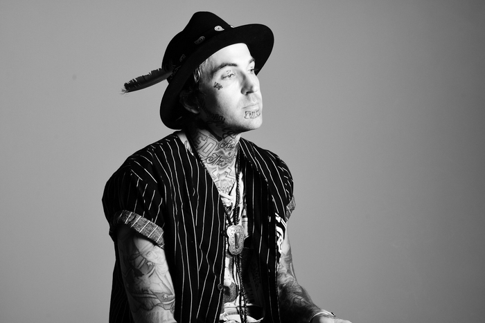 Yelawolf portrait with tattoos and hat
