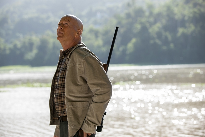 Bruce Willis looking up with rifle in Out Of Death