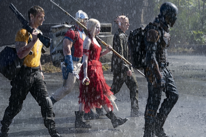 The Suicide Squad walking in the rain