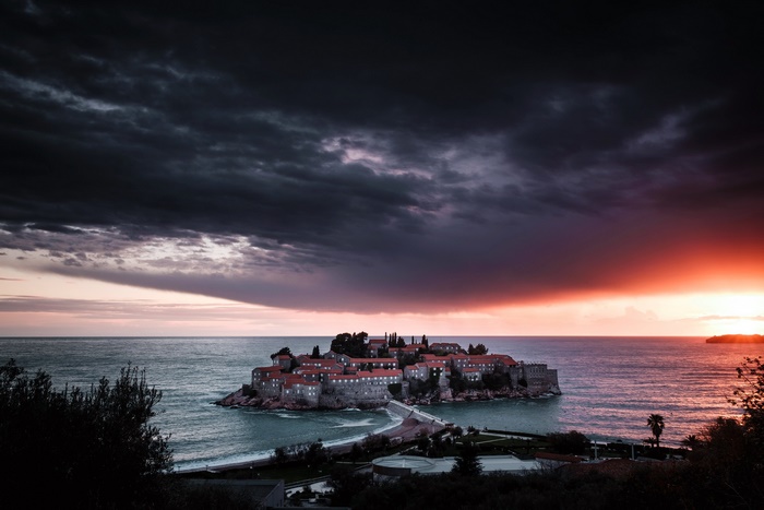 Sveti Stefan island town at dramatic sunset